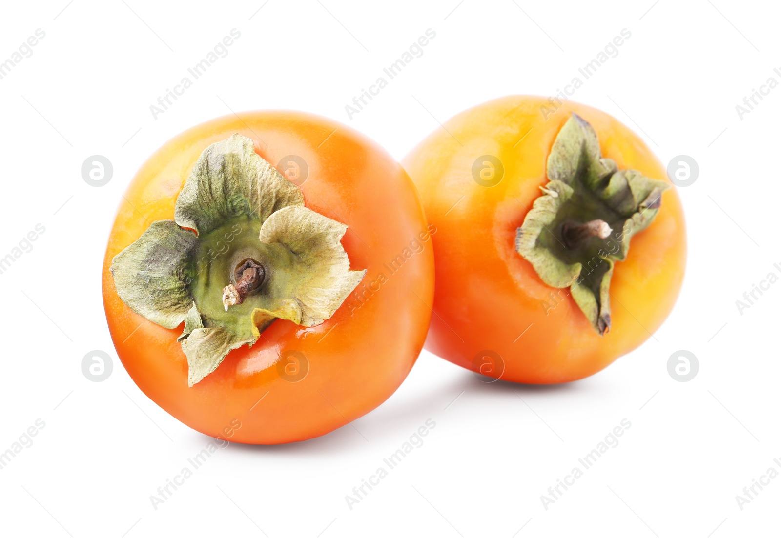 Photo of Delicious ripe juicy persimmons isolated on white