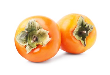 Photo of Delicious ripe juicy persimmons isolated on white