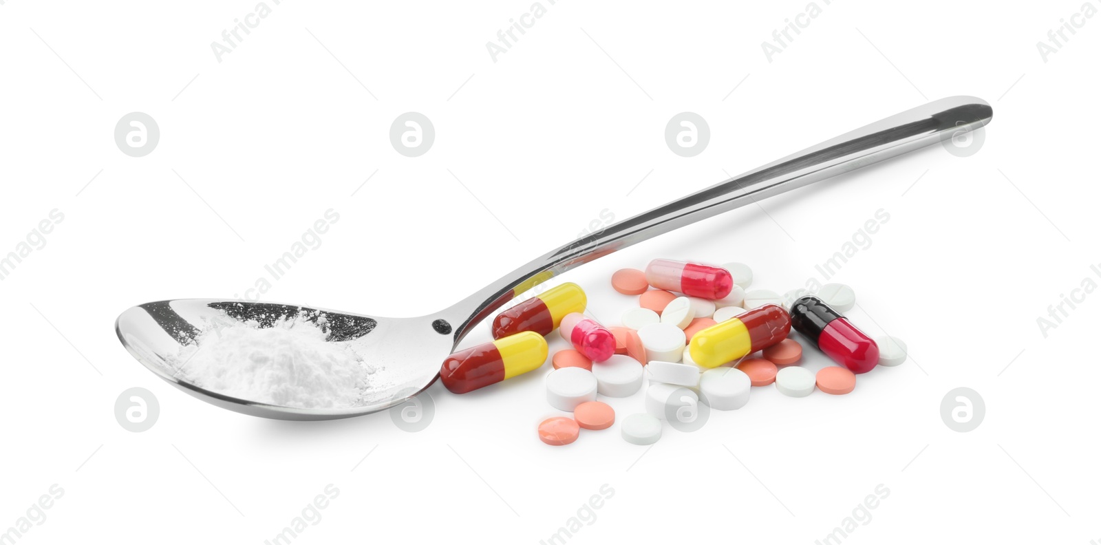 Photo of Drug addiction. Different pills and spoon with powder isolated on white