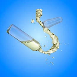 Image of Open ampoule with splashing liquid in air on blue background