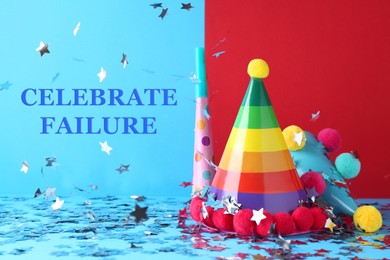 Image of Celebrate failure. Party hats and blower under confetti on light blue background