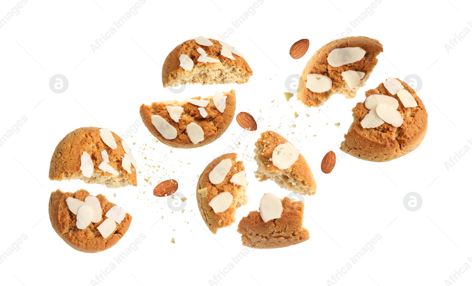 Image of Yummy nut cookies with almond petals in air on white background