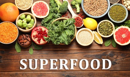 Image of Superfood. Different healthy food products on wooden table, flat lay. Banner design