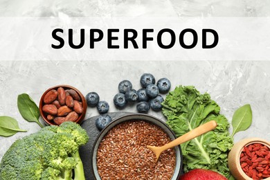 Image of Superfood. Different healthy food products on marble table, flat lay