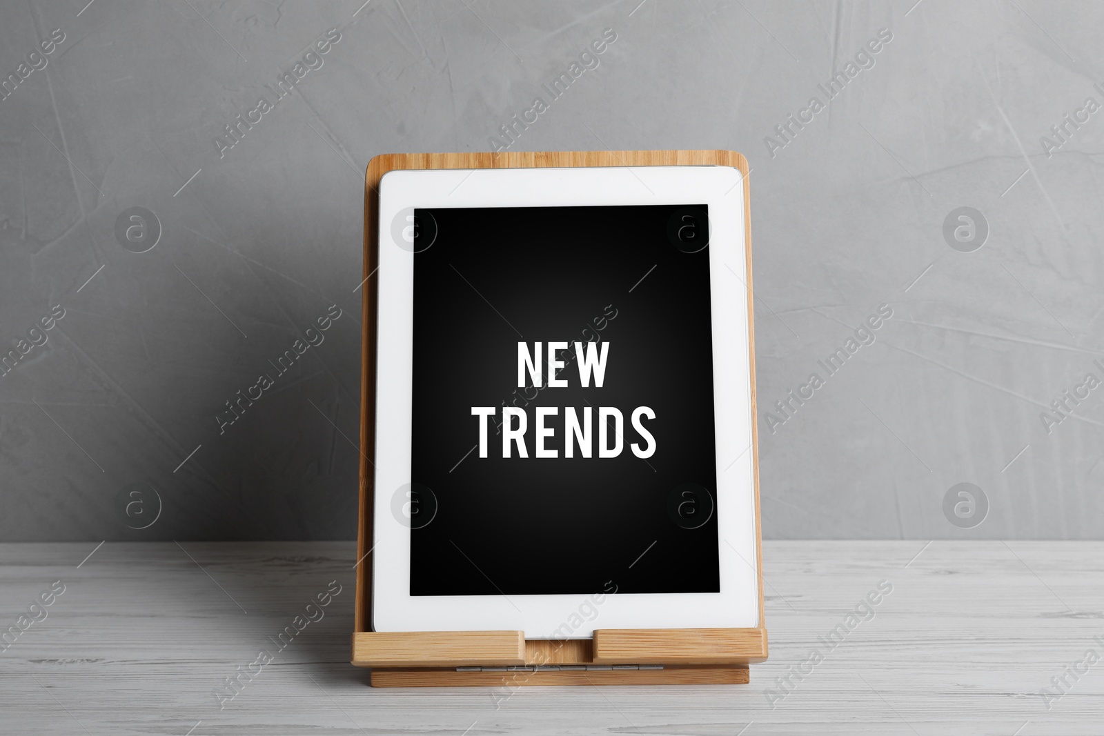 Image of New trends. Tablet on white wooden table