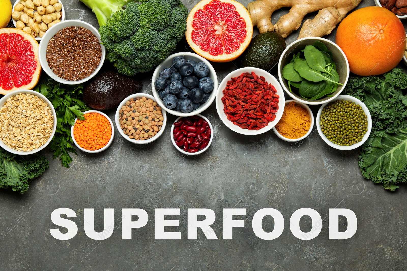 Image of Superfood. Different healthy food products on grey table, flat lay