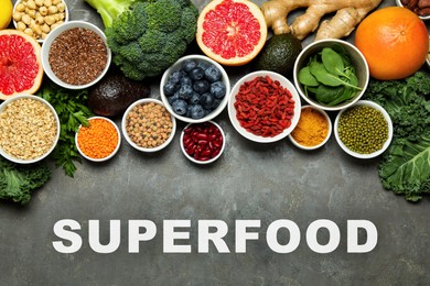 Image of Superfood. Different healthy food products on grey table, flat lay