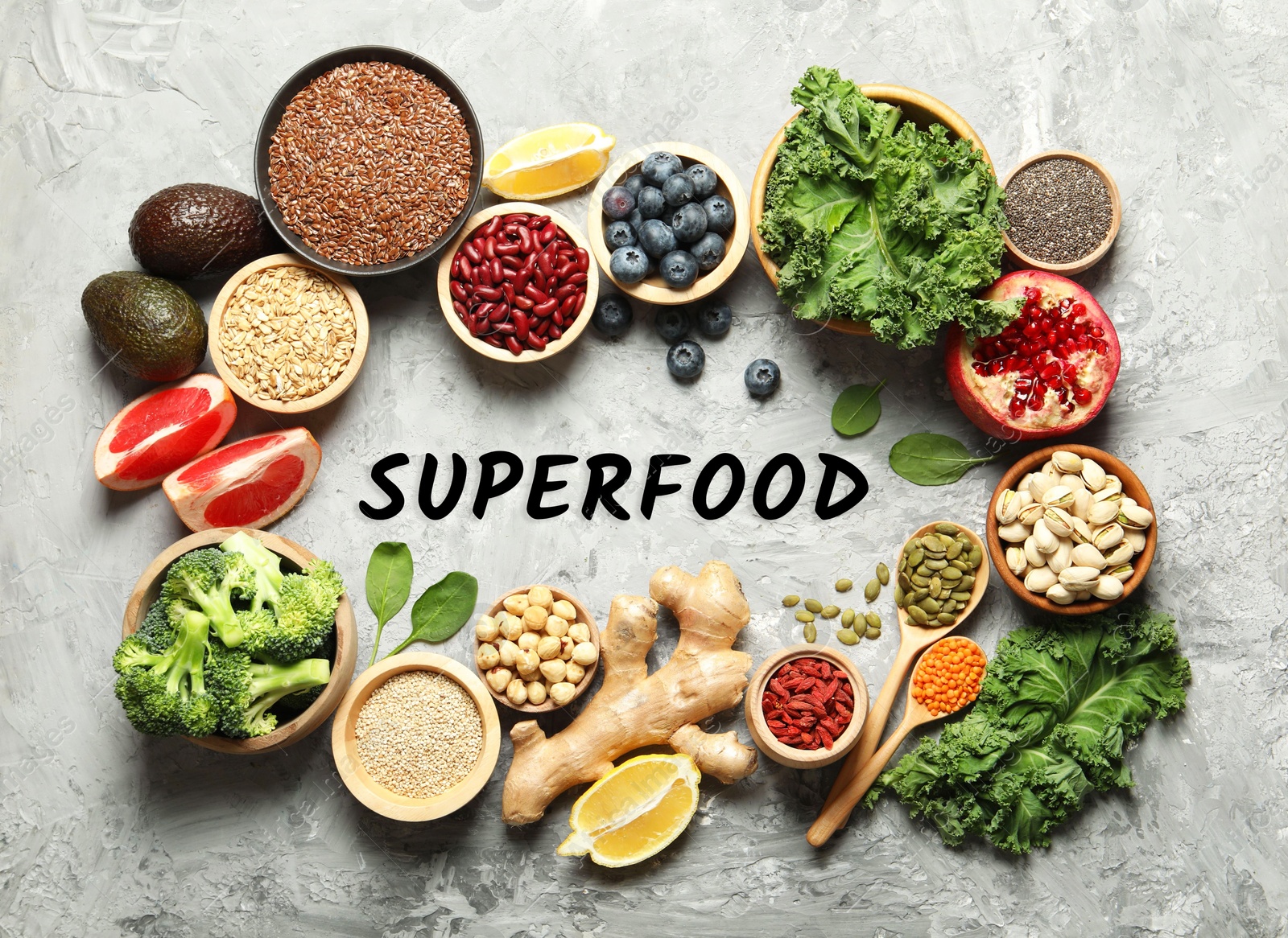 Image of Superfood. Different healthy food products on marble table, flat lay