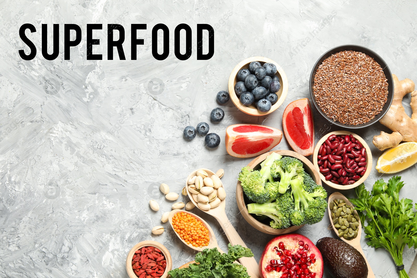 Image of Superfood. Different healthy food products on marble table, flat lay