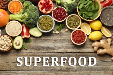 Image of Superfood. Different healthy food products on wooden table, flat lay