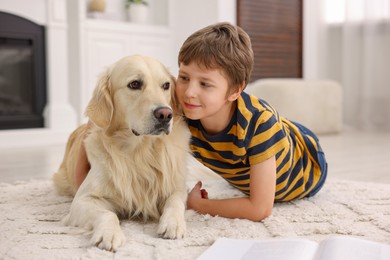 Photo of Boy with his cute dog at home