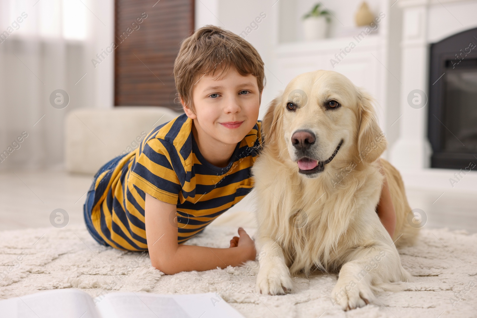 Photo of Boy with his cute dog at home