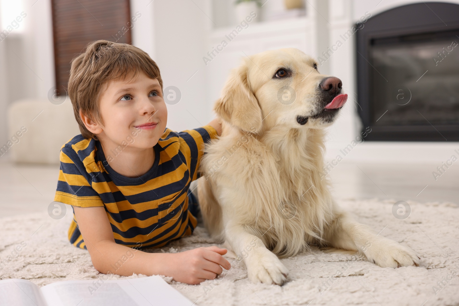 Photo of Boy with his cute dog at home