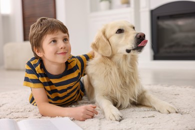 Photo of Boy with his cute dog at home