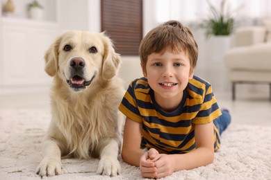 Photo of Boy with his cute dog at home