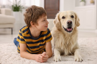 Photo of Boy with his cute dog at home