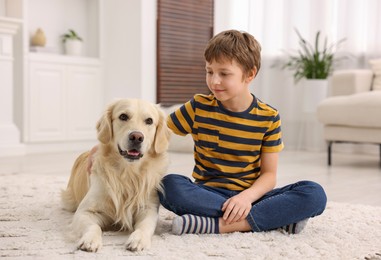 Photo of Boy with his cute dog at home