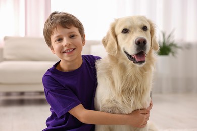 Photo of Boy with his cute dog at home