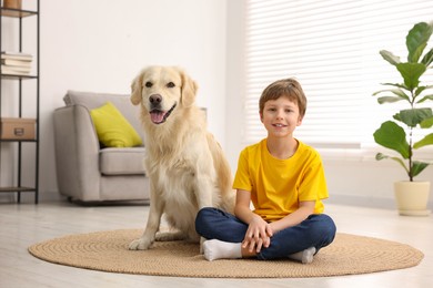 Photo of Boy with his cute dog at home