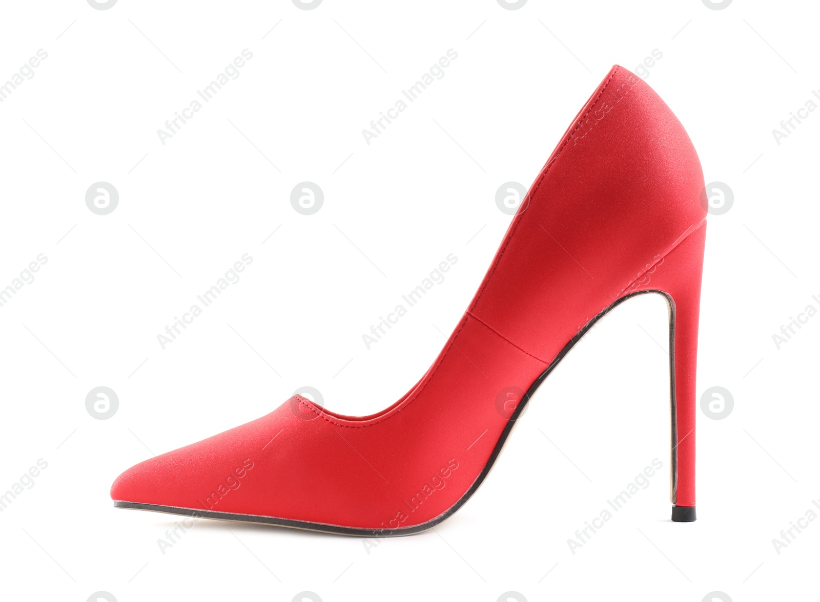 Photo of One red high-heeled shoe isolated on white