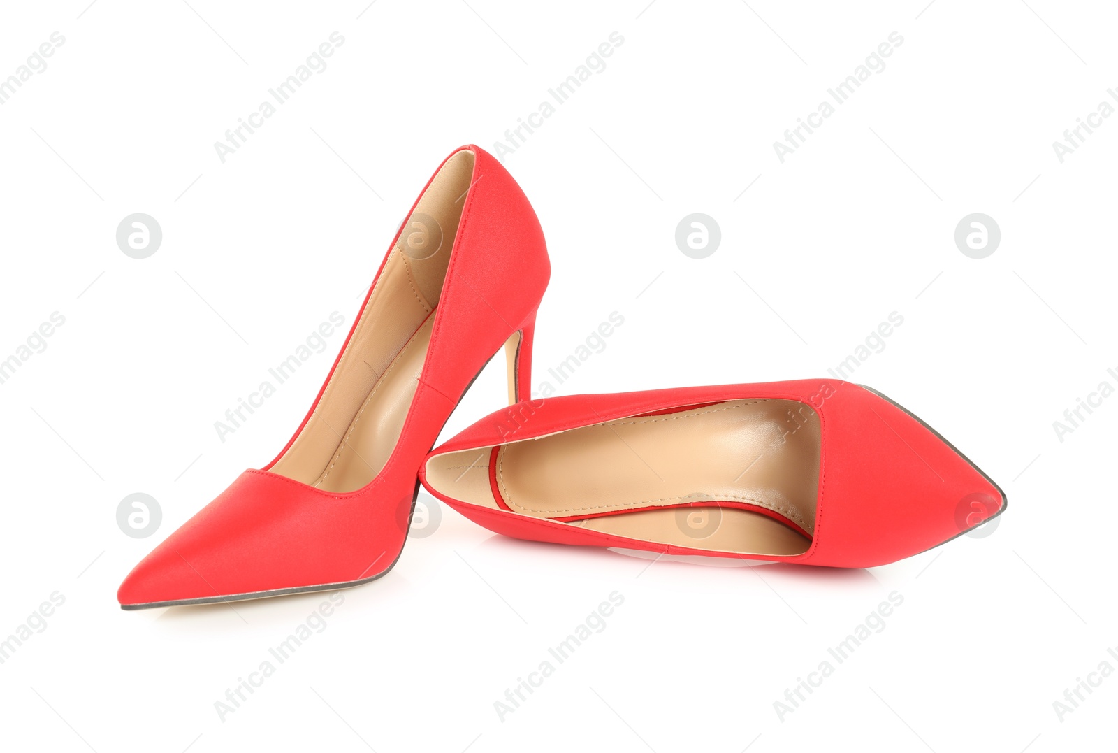 Photo of Pair of stylish red women's shoes isolated on white