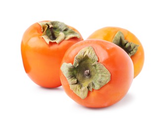 Photo of Delicious ripe juicy persimmons isolated on white