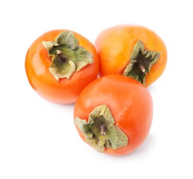 Photo of Delicious ripe juicy persimmons isolated on white