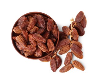 Photo of Bowl with tasty dried dates isolated on white, top view