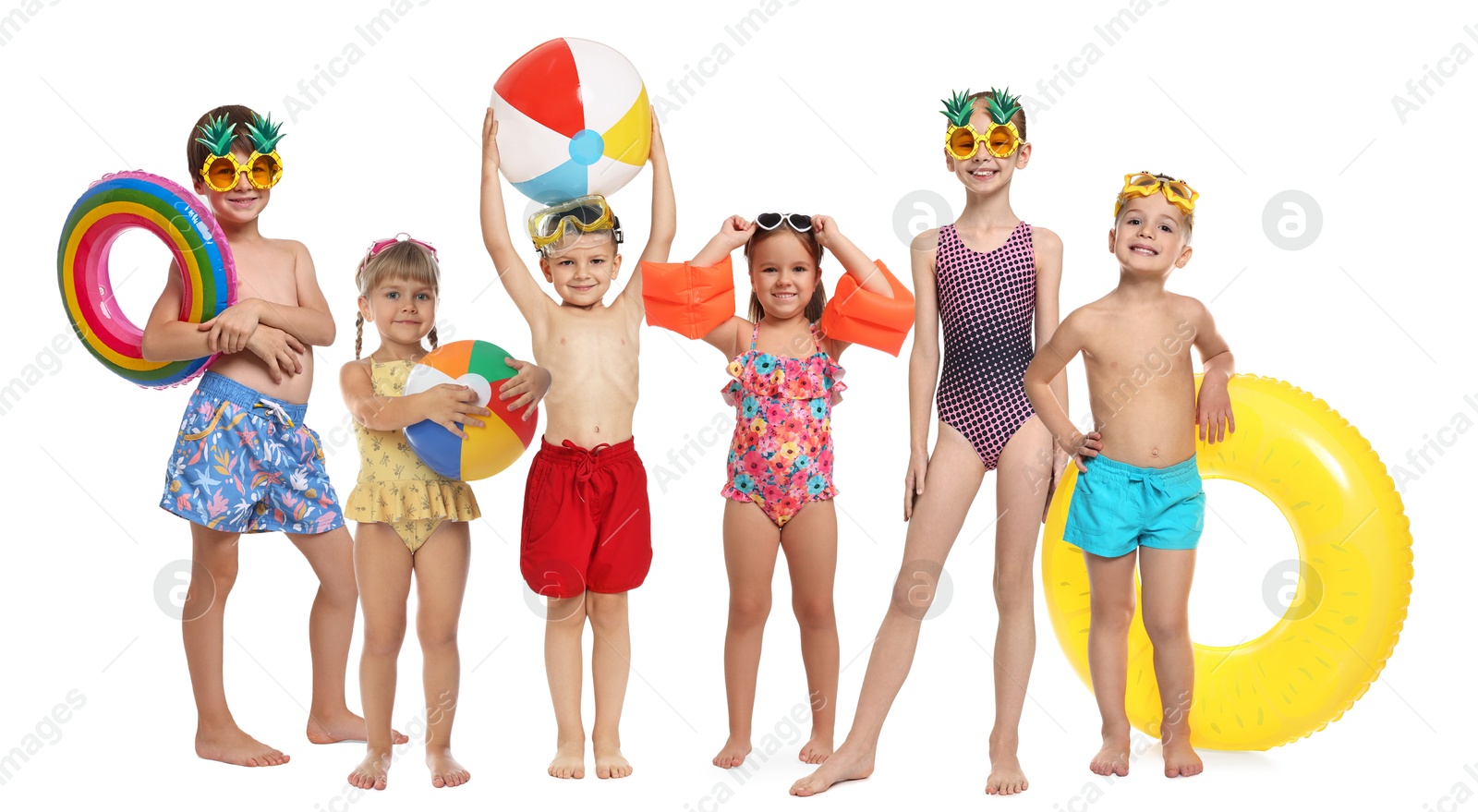 Image of Happy children in swimwear with beach items on white background