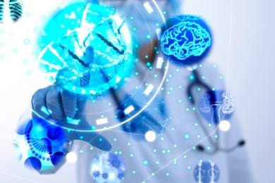 Image of Medical technology. Doctor using virtual screen, closeup. Illustration of brain, kidneys, human skeleton and DNA