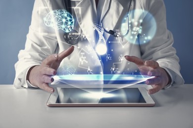 Image of Medical technology. Doctor using tablet, closeup. Chemical formulas, illustration of brain and DNA over device