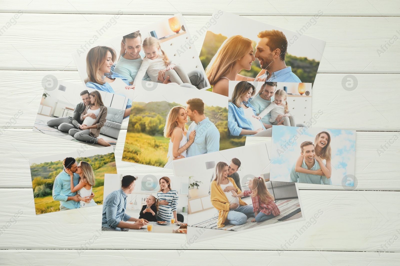 Photo of Different family photos on white wooden table, flat lay