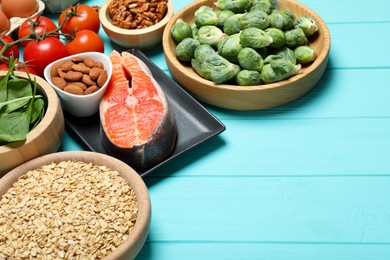 Photo of Different fresh products rich in melatonin on light blue wooden table, closeup