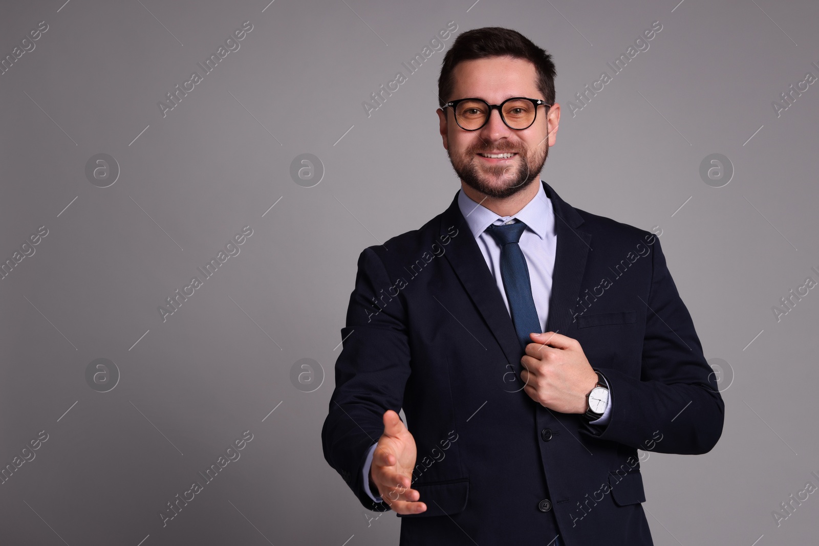 Photo of Portrait of banker in glasses on grey background, space for text