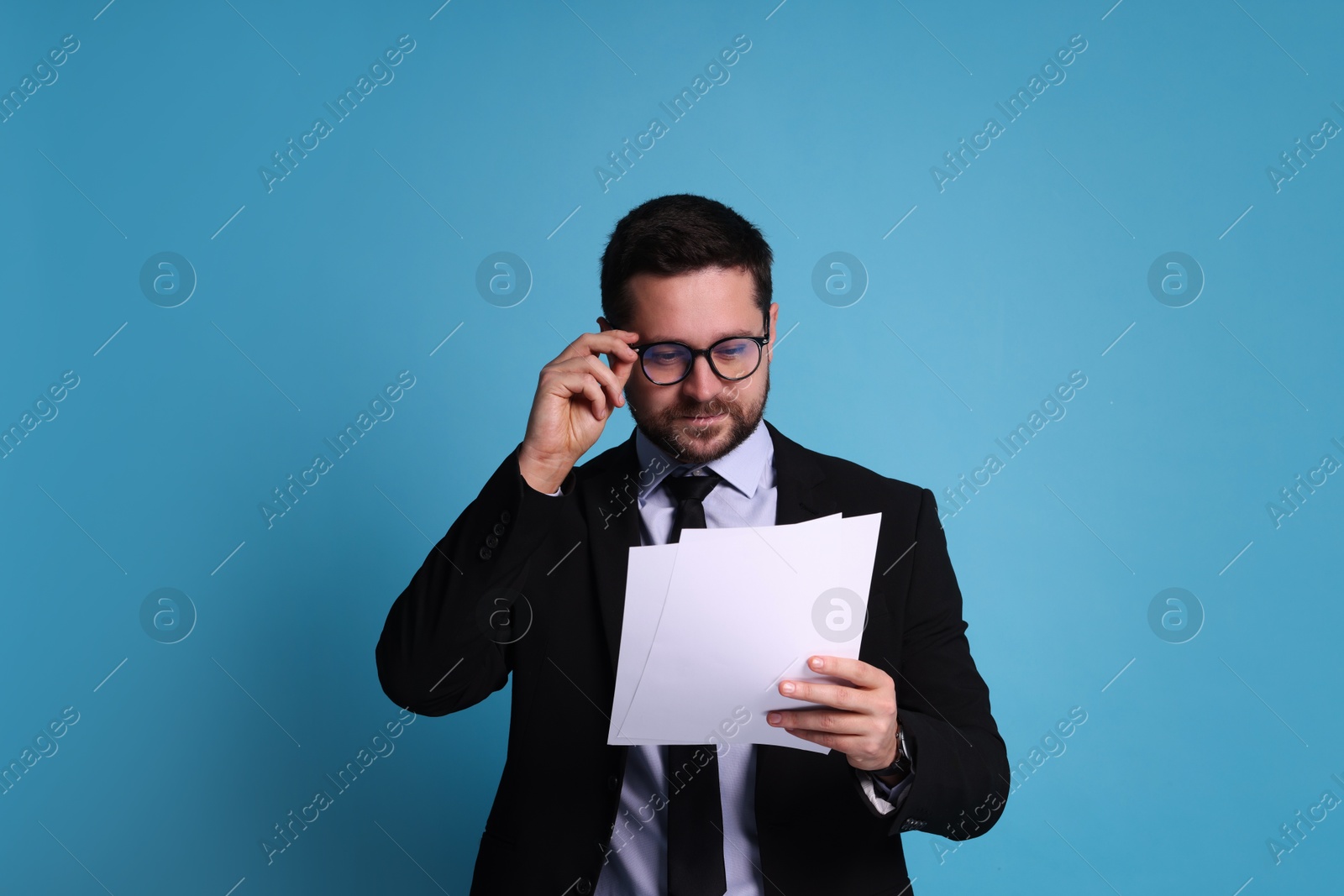 Photo of Banker with documents on light blue background