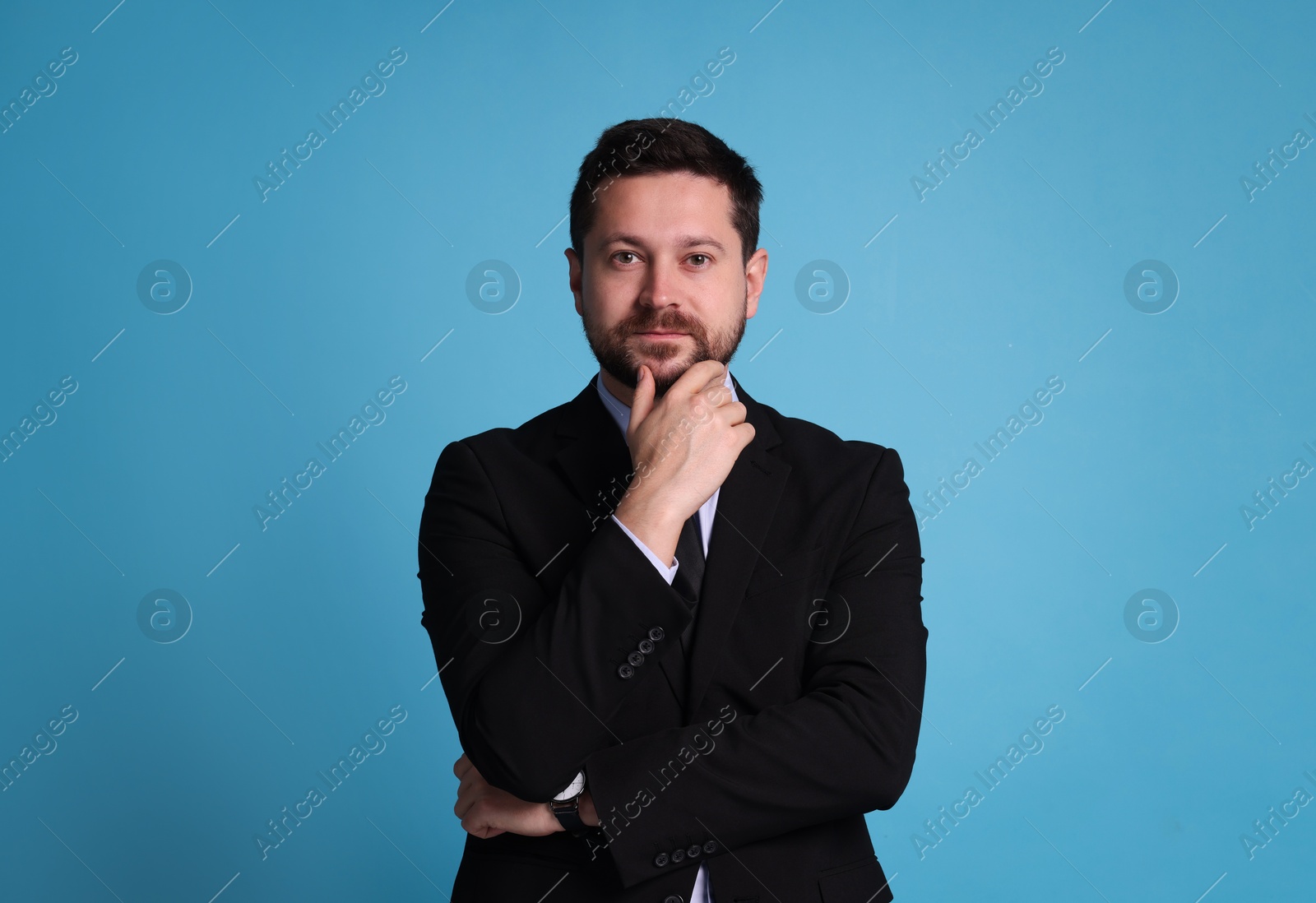 Photo of Portrait of banker on light blue background