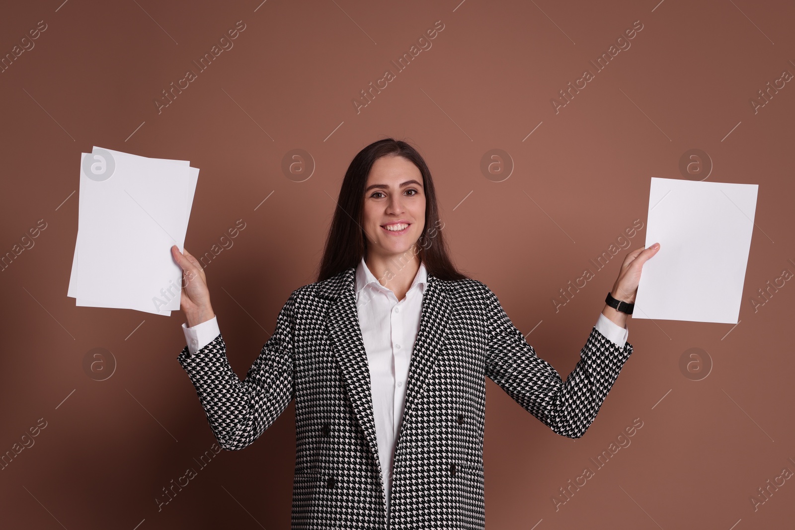 Photo of Portrait of banker with documents on brown background