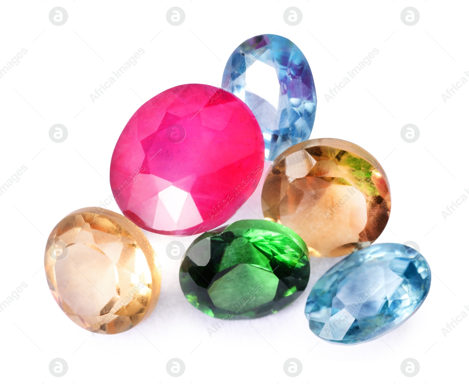 Photo of Different colorful shiny gemstones isolated on white