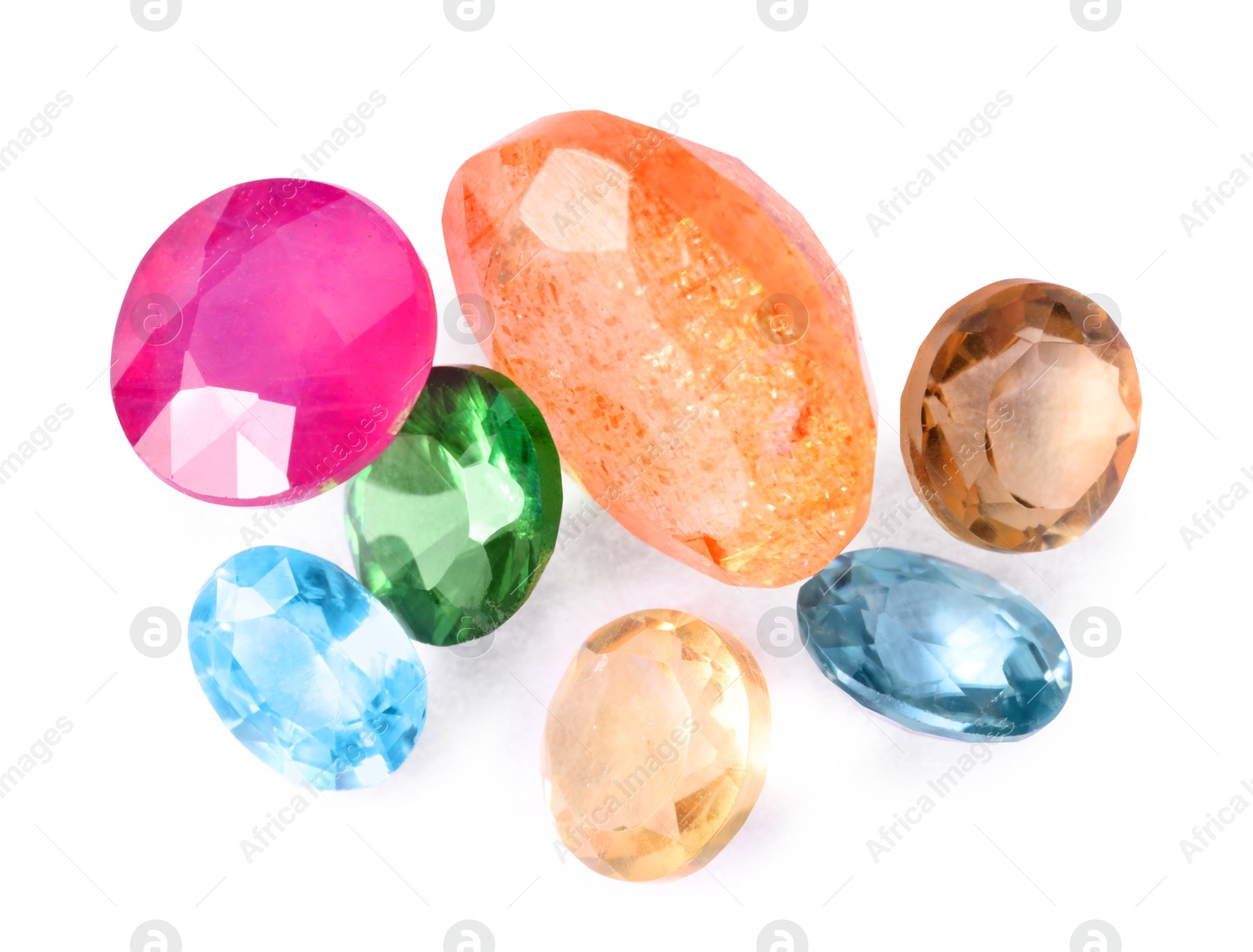 Photo of Different colorful shiny gemstones isolated on white