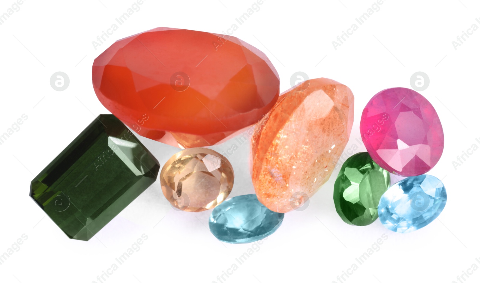 Photo of Different colorful shiny gemstones isolated on white