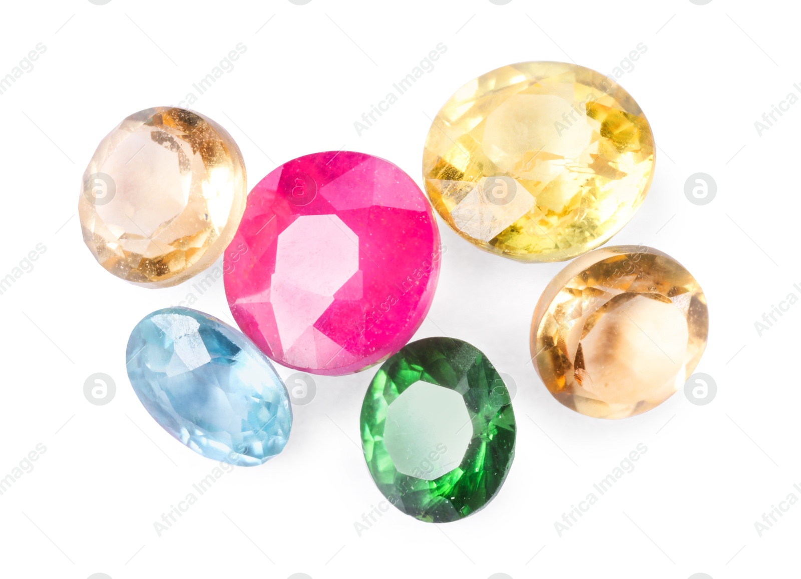 Photo of Different colorful shiny gemstones isolated on white