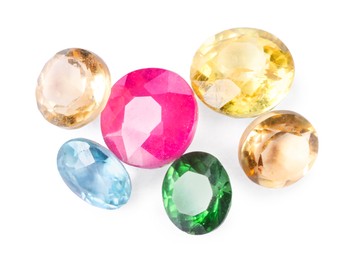 Photo of Different colorful shiny gemstones isolated on white