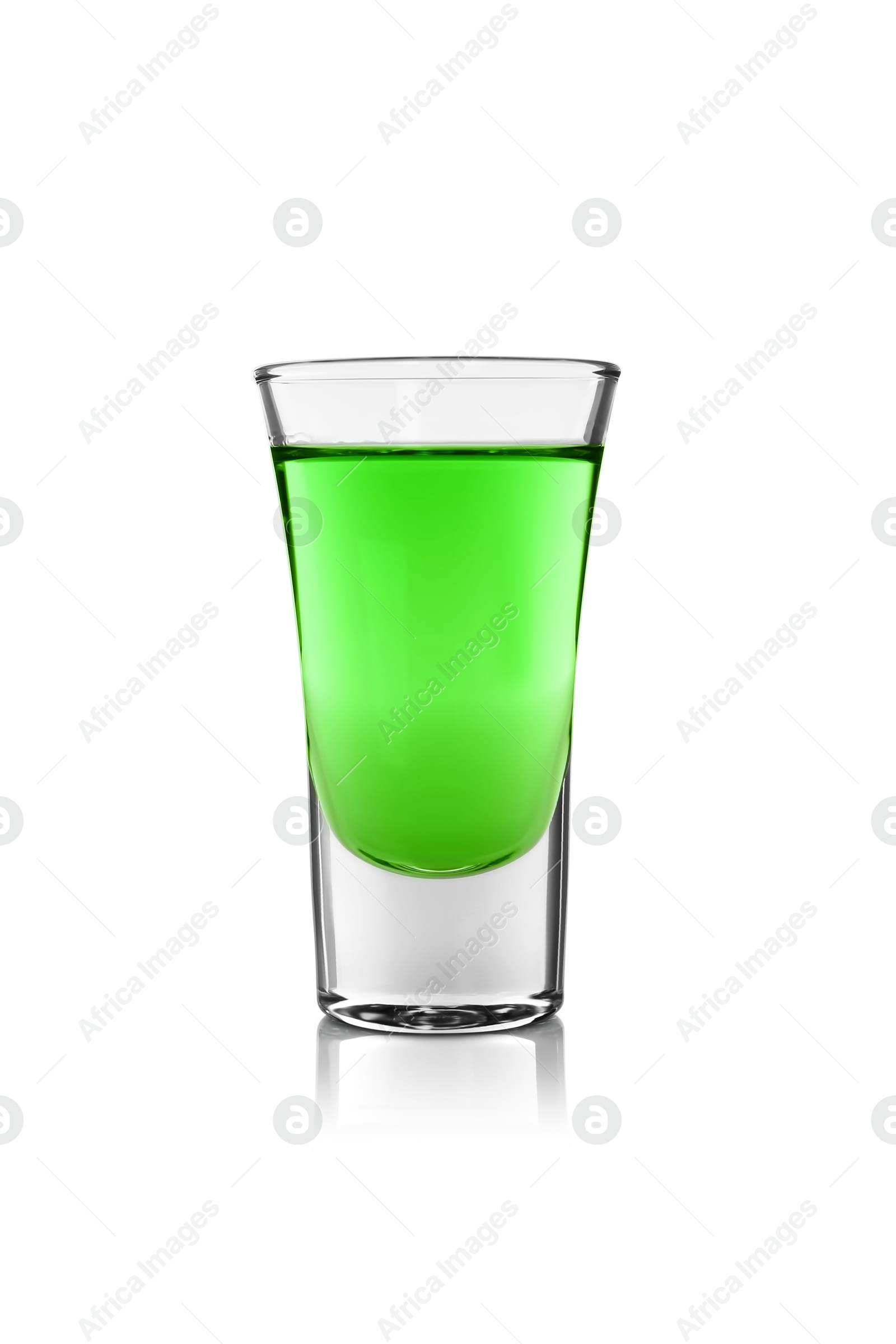 Photo of Absinthe in shot glass isolated on white