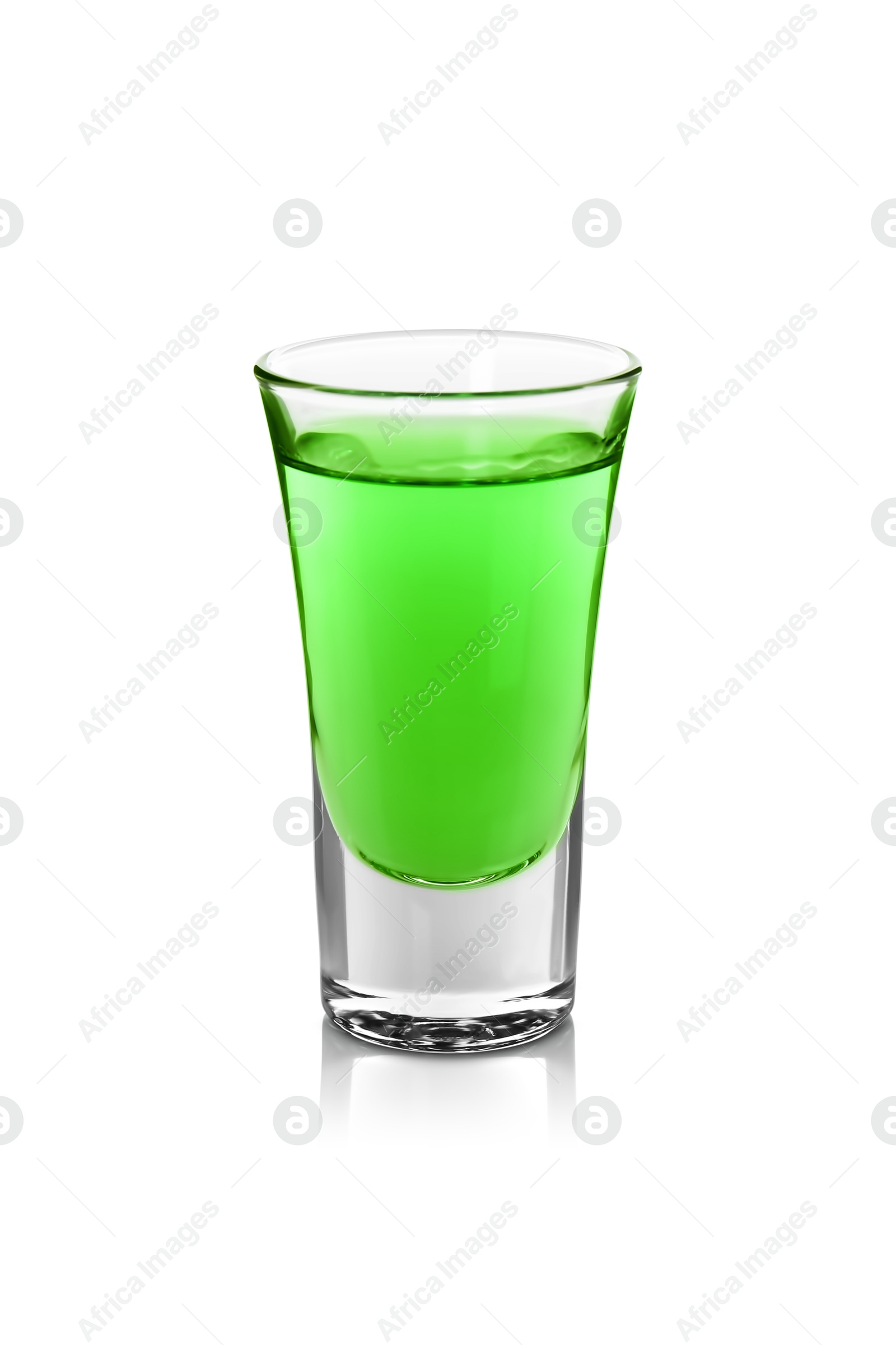 Photo of Absinthe in shot glass isolated on white