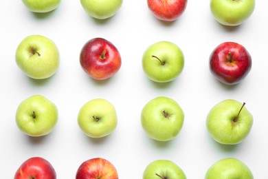 Photo of Red and green apples on white background, flat lay