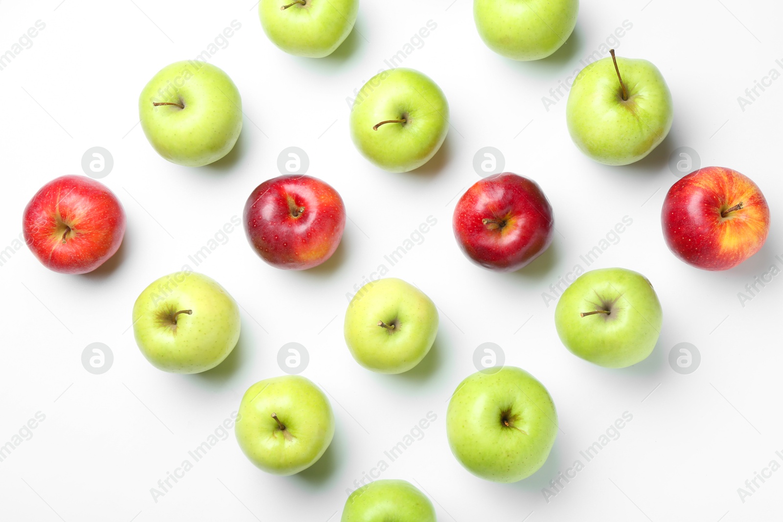 Photo of Red and green apples on white background, flat lay