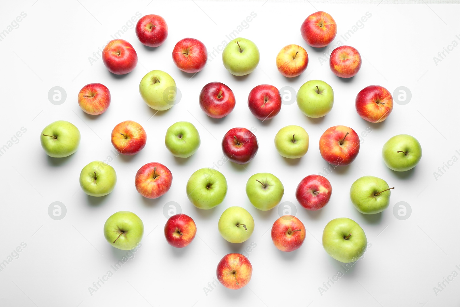 Photo of Red and green apples on white background, flat lay