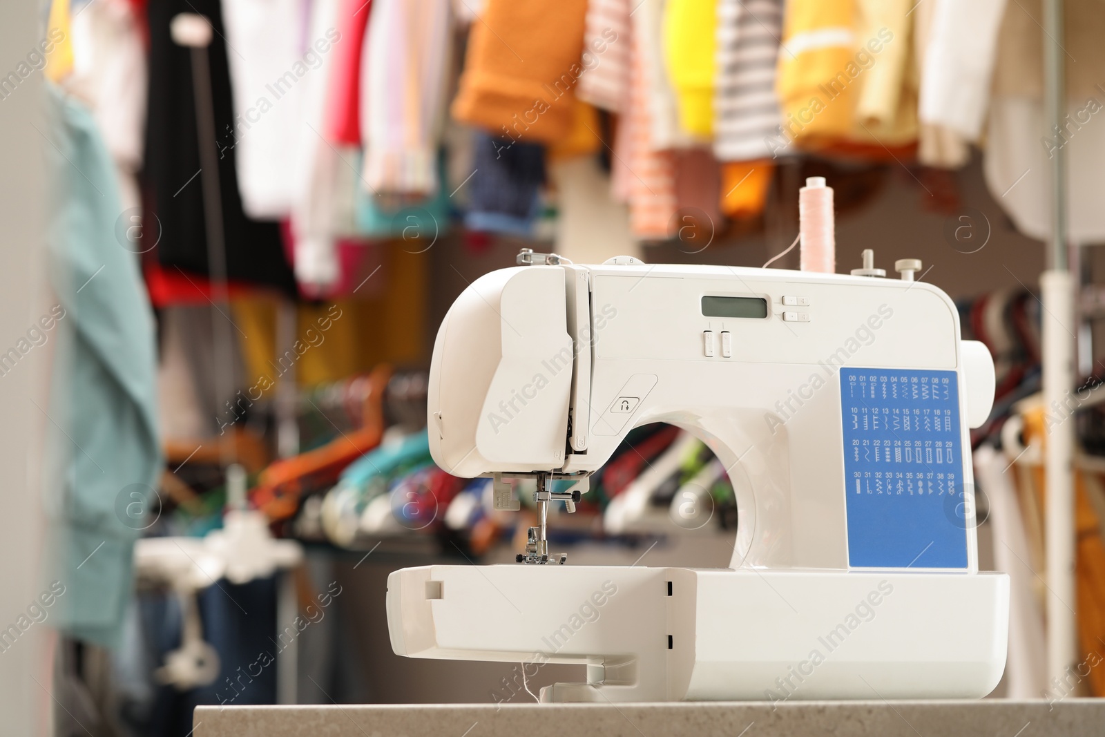 Photo of One sewing machine with thread in workshop