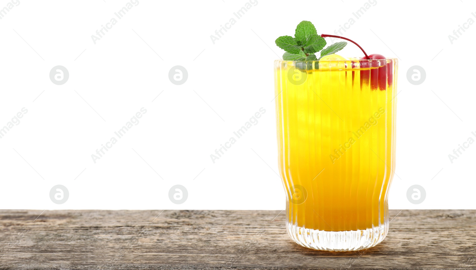 Photo of Tasty pineapple cocktail with mint and cherry in glass on wooden table against white background, space for text