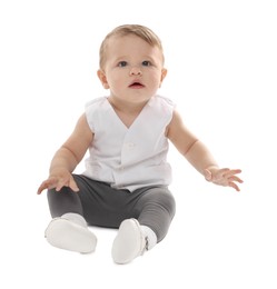 Photo of Cute little baby sitting on white background